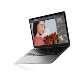 Fototapete - Laptop with photo editor application isolated on white