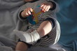© Primus_1 - Little baby in a baby cot, playing, researching touches and sounds and environment.