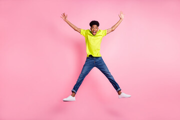 Wall Mural - Full length body size view of attractive cheerful amazed guy jumping fooling isolated over pink pastel color background