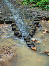 Cobblestones Washed Out And Washed Away By The Power Of Water