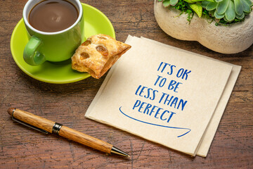 Wall Mural - it is OK not to be less than perfect - inspirational handwriting on a napkin with a cup of coffee, acceptance, positive mindset, success and personal development concept