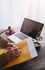 Wall Mural - Business and lawyers discussing contract papers with brass scale on desk in office. Law, legal services, advice, justice and law concept picture with film grain effect