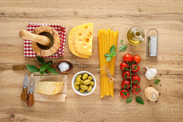 Sticker - Italian food. Culinary concept background with ingredients for cooking on wooden kitchen rustic table, top view with copy space. Ingredients for cooking pasta.