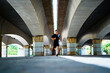 © Cavan Images - Sportsman running under a bridge