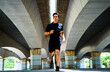 © Cavan Images - Sportsman running under a bridge