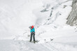 © Cavan Images - Woman climber abseiling Island Peak's headwall