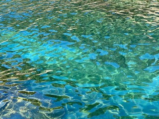 Canvas Print - Emerald green blue sea water surface. Glittering shiny rippled ocean water. Beautiful summer seascape. Zen, relax, freshness.