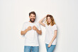 © SHOTPRIME STUDIO - young couple in white t-shirts communication clothes jeans light background