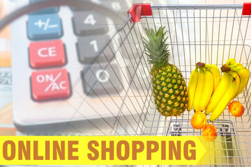 Poster - Online shopping. Yellow lettering on the background of a shopping cart with food. Online grocery store. Buying products with home delivery.