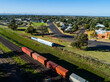 © Austockphoto - Containers on freight transport train on train line