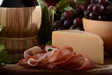 Wall Mural - Antipasto with grape, cheese and prosciutto, , selective focus