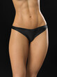 © igor_shmel - Abdominal press, flat belly. Woman Body care. Close up of female body in black panties.