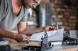 © puhimec - Carpenter's workflow, carpenter looks at the drawings.