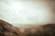 © Cavan Images - A bright afternoon bursts through the clouds on a rainy afternoon.