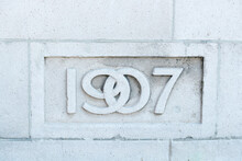 Number 1907 In Art Nouveau Font Set In Concrete
