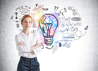 Wall Mural - Attractive business woman in formal wear with crossed arms pose pondering about new start up nearby concrete wall with colorful business idea light bulb sketch. creativity and brainstorming