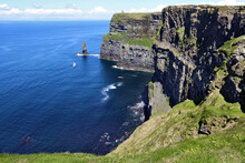 Mesmerizing View Of The Cliffs Of Moher Under The Cloudy Blue Sky In The Republic Of Ireland