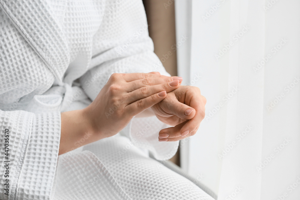 Woman applying shea butter, closeup