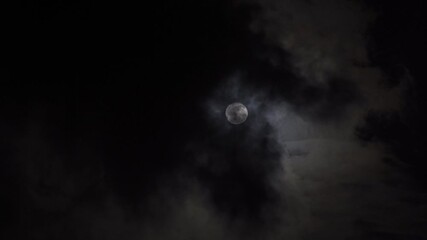 Wall Mural - full moon on dark cloudy night.