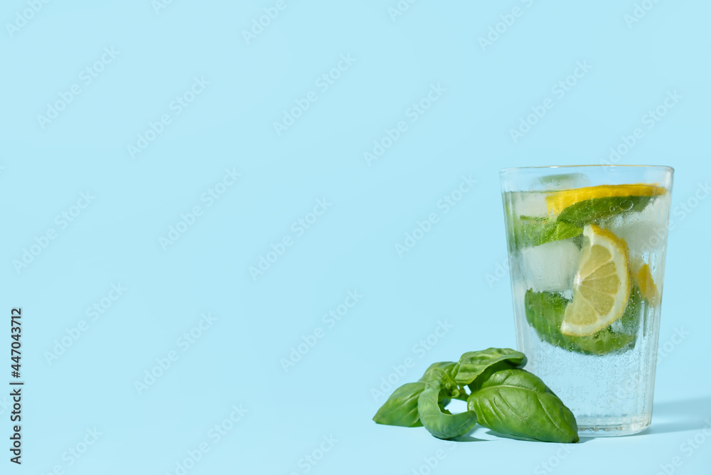 Glass of tasty lemonade with basil on background - obrazy, fototapety, plakaty 