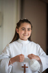 Canvas Print - Happy young girl dressed as first communion.