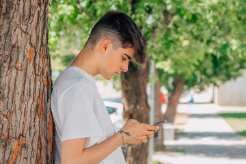 Poster - boy on the street with mobile phone