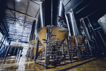 Rows of steel tanks for beer fermentation and maturation in a craft brewery