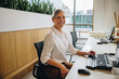 © Jacob Lund - Friendly receptionist working in office