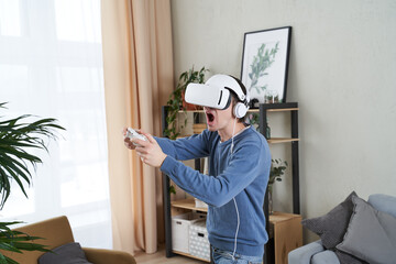Wall Mural - man with virtual reality headset is playing game.