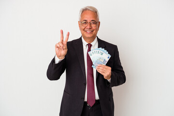 senior american business man holding bills isolated on white background showing number two with fing