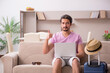 © Elnur - Young man preparing for trip at home