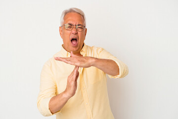 Wall Mural - Senior american man isolated on white background showing a timeout gesture.