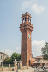 Wall Mural - Clock Tower at Campo Santo Stefano on island of Murano, Venice, Italy