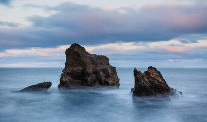 Wall Mural - Icelandic wild coast with large rocks on the beach