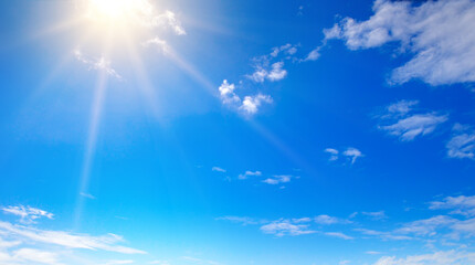 Wall Mural - blue sky , sun and beautiful white clouds. Wide photo.