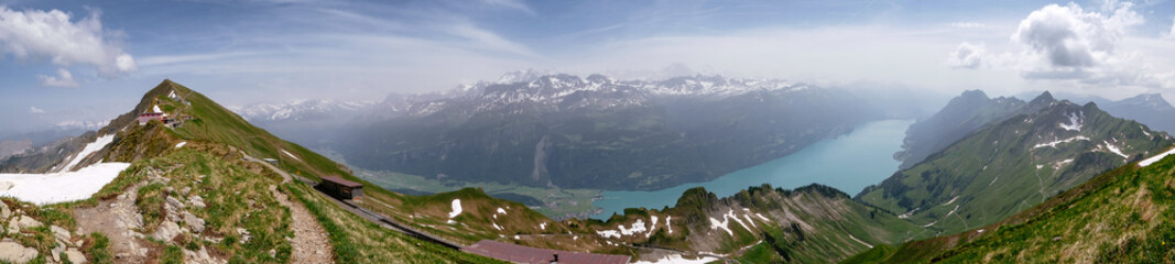 Aerial Panoramic View - Train from Rothorn to Brienz - Brienz-Rothorn bahn is a cogwheel narrow gauge railway with beautiful mountain and Brinzersee lake views in Switzerland, Swiss Alps