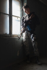 Wall Mural - Mercenaty soldier with a rifle concept.