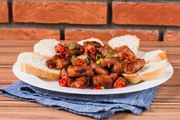 Wall Mural - sausage portion with wood and brick background