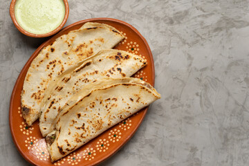 Wall Mural - Mexican food. Quesadillas on grey background