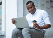 © Nuad Contributor - portrait  African American  men smiling confident reading learning online on laptop
