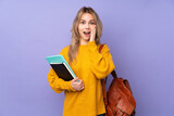 Fototapeta  - Teenager Russian student girl isolated on purple background with surprise and shocked facial expression