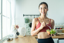 Portrait Of Asian Attractive Woman Hold Salad Bowl And Look At Camera. 