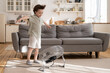 © DimaBerlin - Little preschool boy enjoy fresh air flow from fan. Cute small kid play with ventilator blowing cool wind alone in living room at home. Cute child have fun indoors in apartment one. Childhood leisure