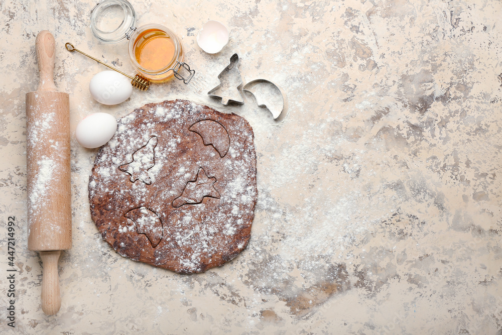 Fresh dough with ingredients for preparing cookies and utensils on grunge background