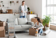 © Pixel-Shot - Young couple in kitchen on moving day