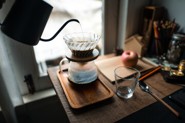 Wall Mural - drip coffee in house,Pouring a hot water over a drip coffee