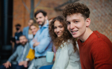 Wall Mural - Portrait of businesspeople entrepreneurs indoors in office, looking at camera.