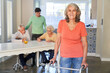 © Robert Kneschke - Elderly woman with walking aid after a stroke in rehab