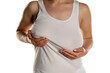 © vladimirfloyd - A woman in white shirt holds her univen big breasts