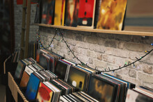 Rack And Shelf With Different Vinyl Records In Store